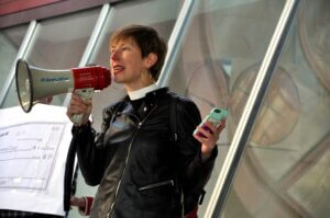 Pastor Korla Masters holding a megaphone. 