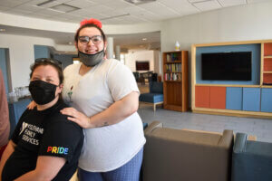 A resident and a case manager at the Prior Crossing BBQ