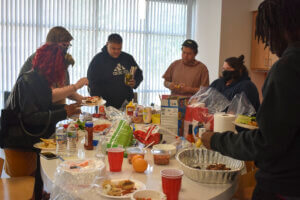 Residents getting food at the Prior Crossing BBQ