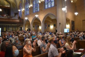 A packed crowd at Building a City for All of Us