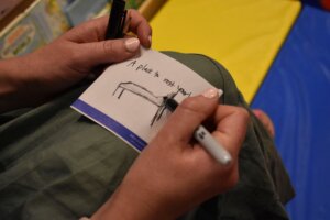 An attendee drawing a bed.