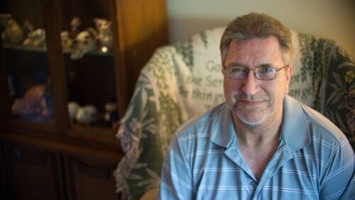 John Fritz smiling in chair - small print size